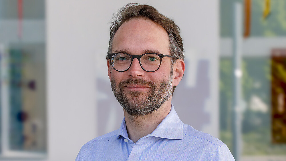 Jörg Kretzschmar lächelt in die Kamera.